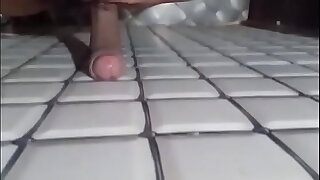 Rubbing uncut cock on wall